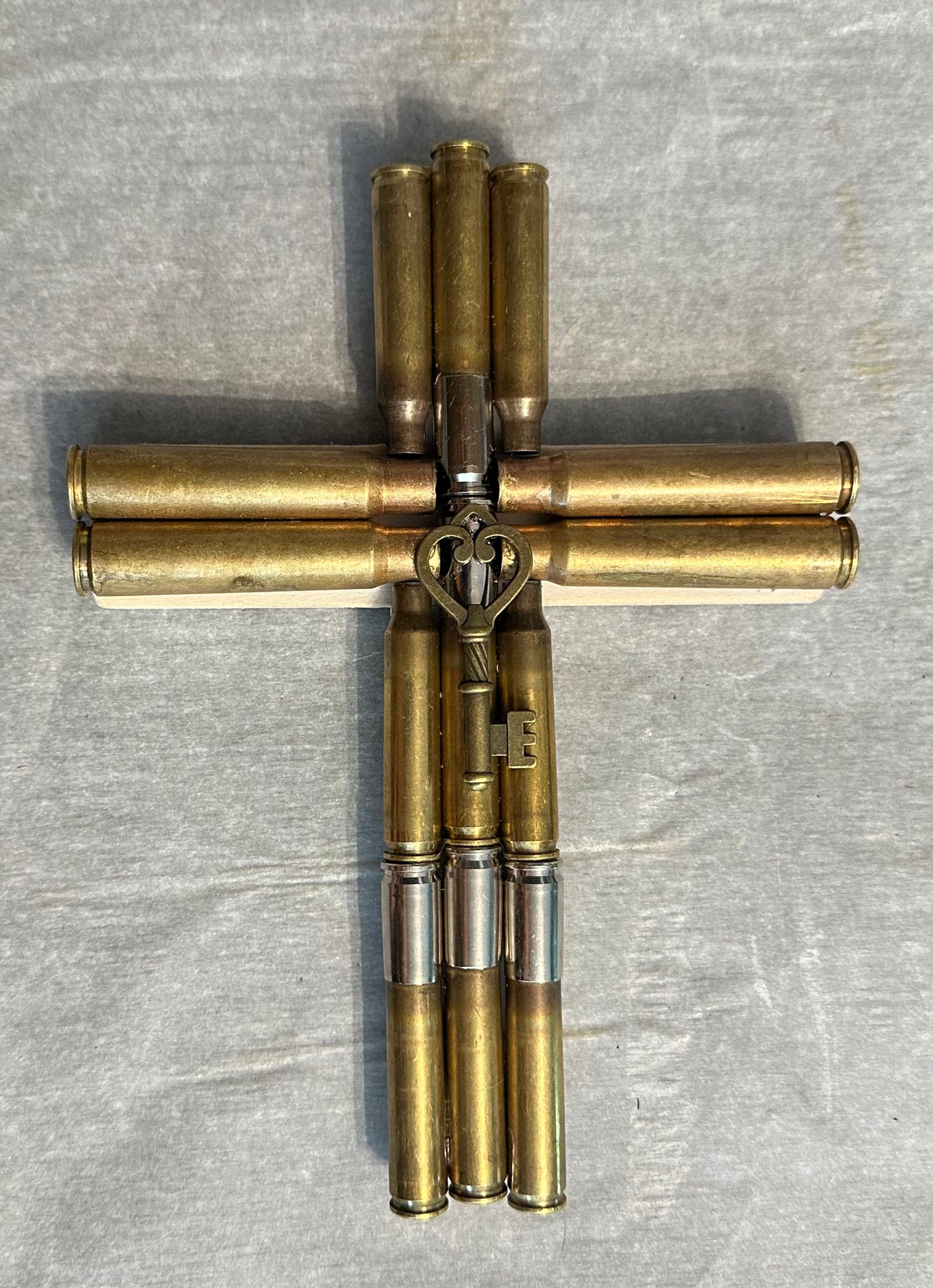 Bullet casing cross with key